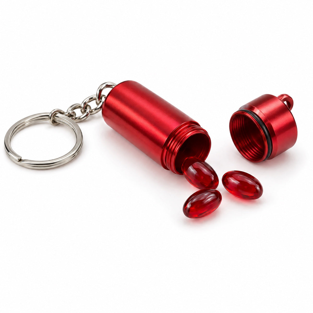 Cherry-red on-the-go softgel case on a keyring